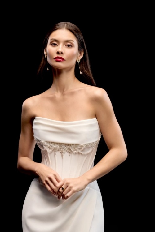 Photo of the model posing near the desk