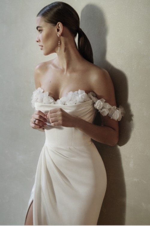 Photo of the model wearing a white gown