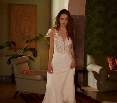 Photo of the model posing and wearing a bridal gown