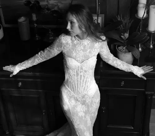 Photo of the model posing and wearing a bridal gown